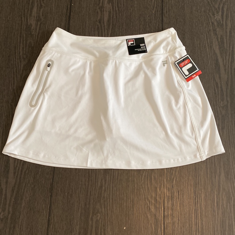 FILA golf skort. Size L. White with one side zip pocket. Shirts underneath.